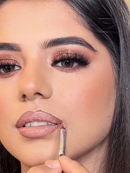 A close-up of the lip contouring process. This technique helps to create the illusion of fuller, more defined lips, which is a key part of my signature glam look.