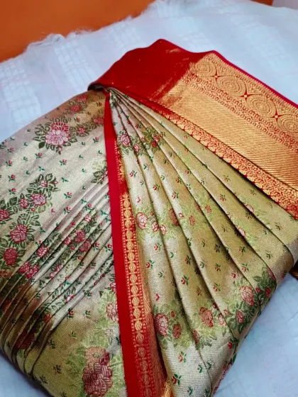 A lovely floral silk saree with a red and gold border. My pre-pleating and box folding service in Jayanagar makes it ready for any event.