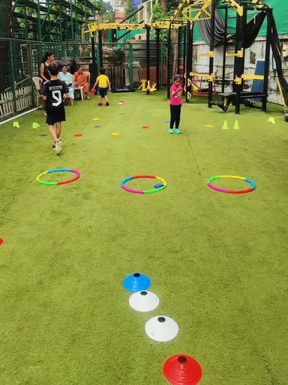 Welcome to our playground! We set up exciting obstacle courses with hula hoops, cones, and more to challenge kids in a fun way. This setup encourages problem-solving and physical literacy as they figure out how to navigate each station.