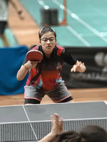 One of our female players mid-rally, showcasing the high level of competition at our WTT Day Special tournament.