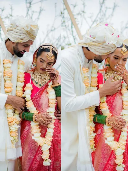 A duplicate of a powerful, emotional moment. The groom wiping away the bride's tears is a testament to their bond and the emotional weight of the wedding day.