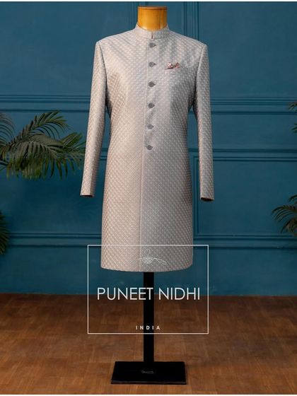Explore ethnicity with our classic Achkans for the wedding season. This grey jacquard piece is a perfect blend of modernity with a classic touch.