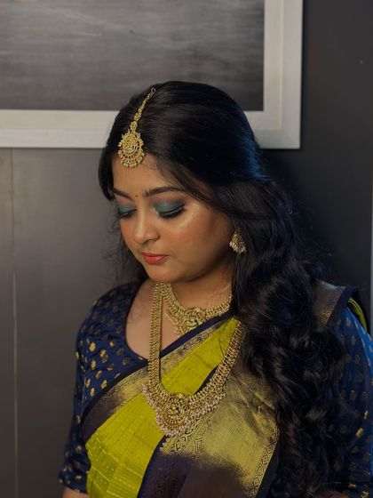 A close-up of the teal and blue smokey eye, demonstrating the advanced blending techniques our students learn in the makeup course.