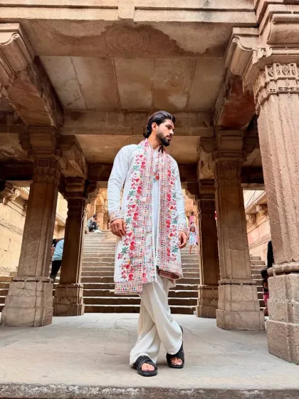 The outfit styled against a beautiful architectural backdrop.