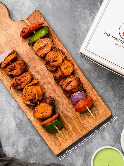 A close-up of our Tandoori Soya Chaap, highlighting the texture and vibrant color from the marinade. This is a fantastic vegetarian alternative that's packed with protein and flavor.
