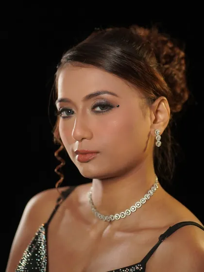 A portrait of the final party glam look. The makeup is sophisticated and designed to last all night.