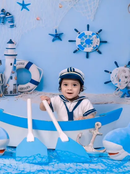 Ahoy, matey! Our sailor theme features a boat, sharks, and a complete nautical backdrop for a fun sea adventure.