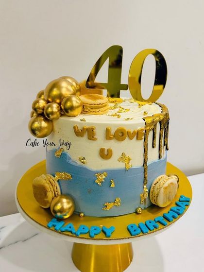 Forty and fabulous, just like this cake. A blue and gold drip cake with macarons.