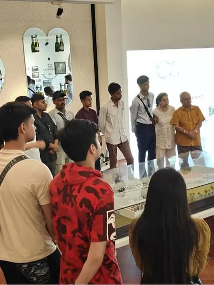 An interactive learning session in progress. Our students engage with an industry guide, asking questions about the winemaking process and international market standards for food and beverage.