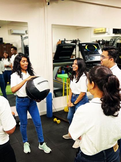 Dr. Chandana engaging with the team. Her exceptional organizational skills and quick learning ability make her a role model within our clinic.