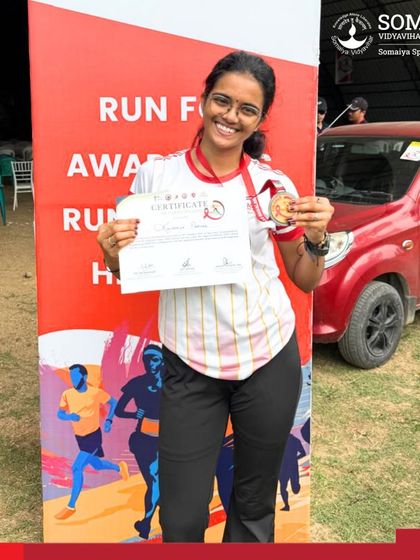 Kaushalya Parmar with her medal and certificate after her powerful 10km run at the National Red Run 3.0, an event raising awareness for a healthier community.