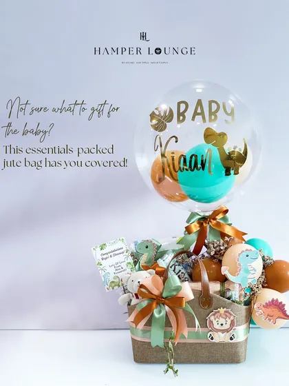 This dinosaur and jungle animal themed hamper is perfect for a little explorer. Packed in a stylish and practical jute bag, it’s filled with essentials and a personalized balloon for baby Kiaan.