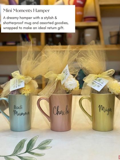 Our 'Mini Moments Hamper' is an ideal return gift. It features a stylish shatterproof mug with assorted goodies, all beautifully wrapped in tulle.