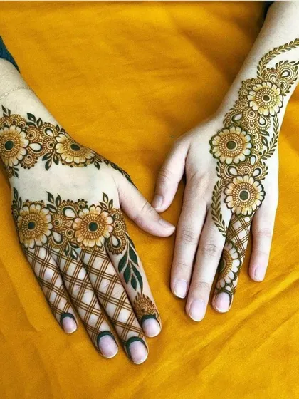 Our skills go beyond traditional designs. Here is an example of a modern floral mehndi with a beautiful jaal (net) pattern, showcasing clean lines and a balanced composition perfect for any celebration.