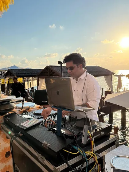 A sunset performance by the water. The beautiful scenery provides a perfect backdrop for a chill yet groovy house and electronic music set.