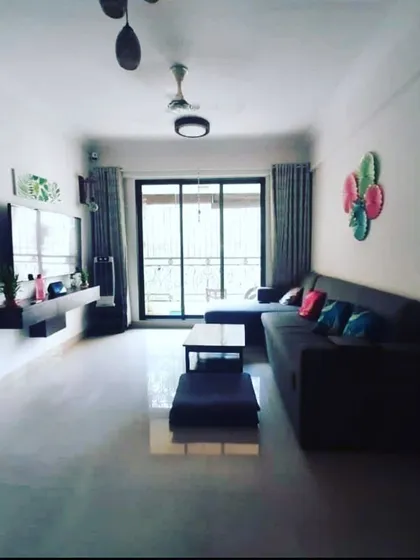 This is a great example of a simple yet impactful living room setup. We used a floating TV unit to save floor space, an L-shaped sofa to maximize seating, and sheer curtains to allow natural light while maintaining privacy.