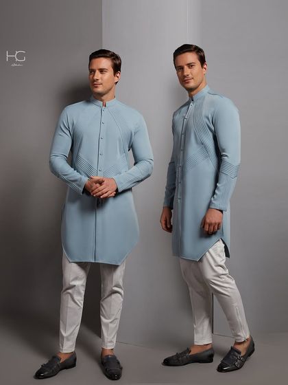 Premium comfort, unparalleled style. This light blue kurta features modern pin-tuck detailing and an elegant, clean cut for a minimalist festive look.