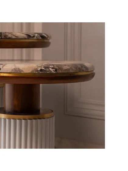Another angle of the side tables, highlighting the contrast between the warm wood and the cool marble.