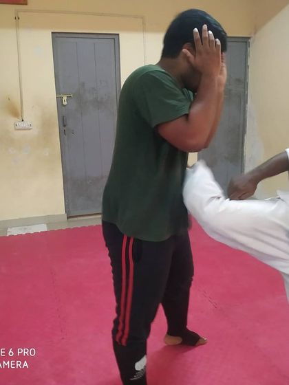 Training to take a body shot. Conditioning the body is just as important as learning to strike.