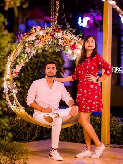 A casual and sweet portrait of a couple on our floral swing at night.