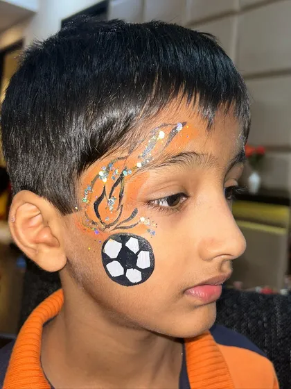 This little guy was a huge football fan, so I painted a soccer ball on fire for him. The glitter adds a cool, fiery effect.