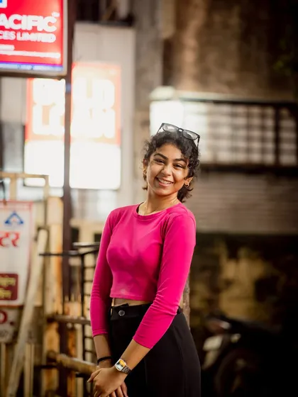 Another joyful portrait from the same set. Her genuine smile is the focal point of the image.