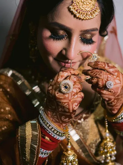 A moment of pure bridal bliss. This close-up showcases the glittery, golden eye makeup and flawless skin I created for this Sikh bride, making her glow on her special day.
