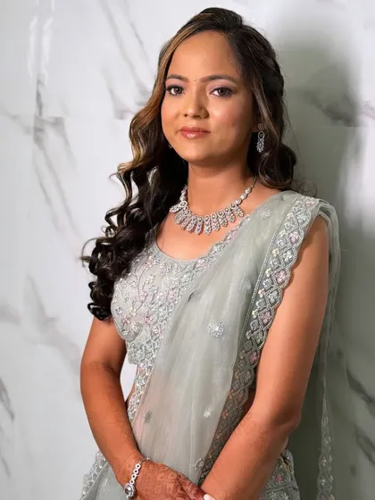 The complete look, showing how the soft makeup and hairstyle come together to create a cohesive and elegant engagement style.