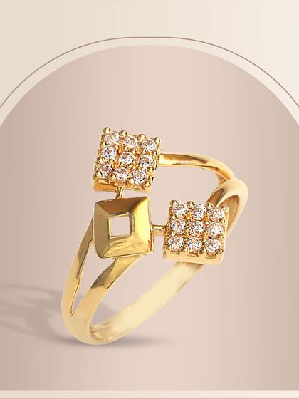 A contemporary gold ring featuring two square clusters of diamonds on an open, split-shank band. This geometric design is both modern and glamorous.