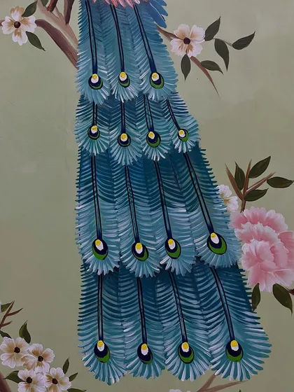 A close-up of the intricate details on the peacock's feathers.