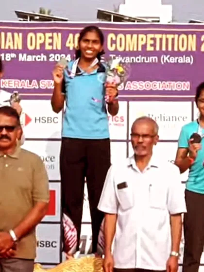 Eekisha Bhadsavale on the podium, proudly holding her bronze medal and flowers at the Indian Open 400m Competition in Kerala.