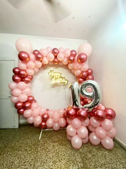A wider view of the 19th birthday balloon ring, showing how it can be set up in the corner of a room.