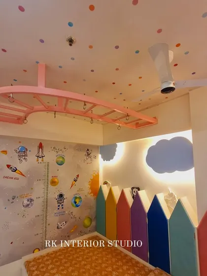 This kids' room features a space-themed wallpaper with a height chart, making it both educational and decorative. The ceiling-mounted monkey bar adds a playful element for active kids.