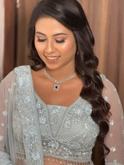 An eyes-closed shot showing the soft, neutral eyeshadow and the radiant finish of the skin. A perfect example of understated elegance.