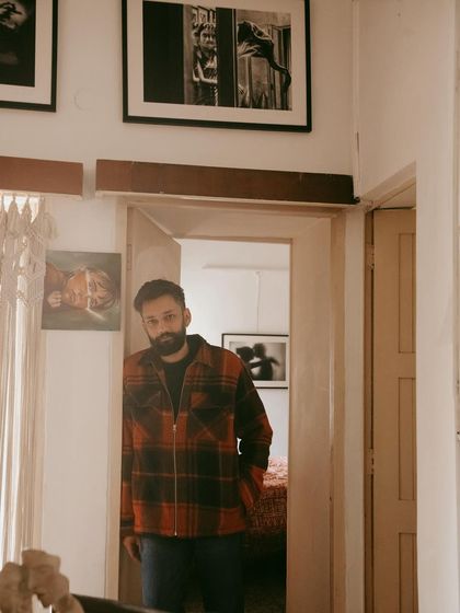 A portrait of a friend in his home, a space filled with art and memories. Capturing people in their personal environment tells such a rich story.