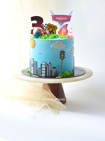 Another angle of the transport theme cake, capturing all the fun details.