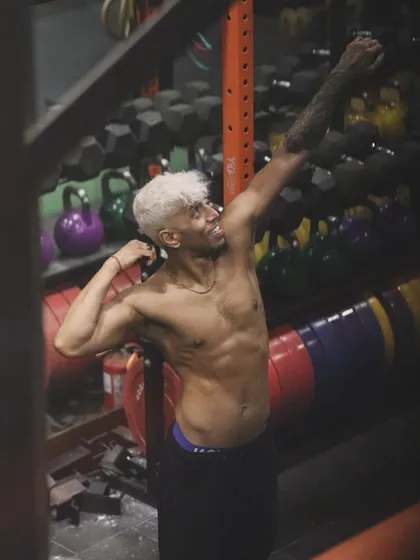 A moment of celebration after the grind. The smile is earned through sweat. This is the feeling of getting stronger, of knowing you gave it your all.