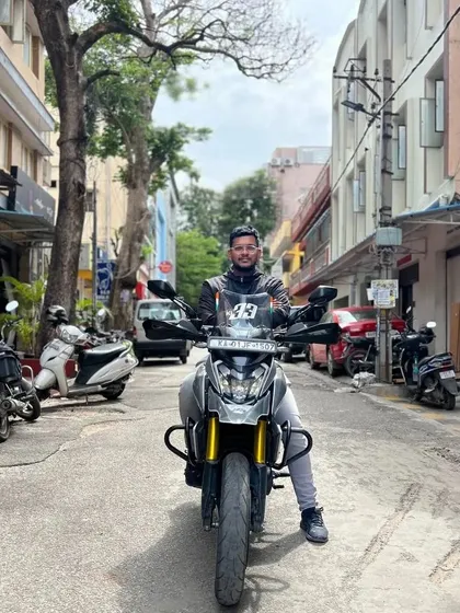 A duplicate image celebrating World Motorcycle Day with a custom Dominar.