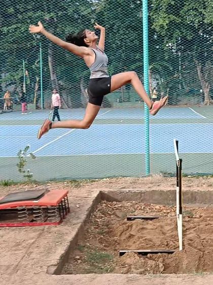 An athlete captured mid-flight during a long jump practice. We focus on perfecting the launch, flight, and landing phases to maximize distance.