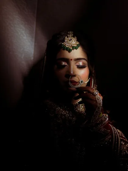I believe in the power of shadows to tell a story. In this bridal portrait, I used a single light source to create a moody, intimate feel, drawing attention to the bride's delicate features and traditional jewelry.