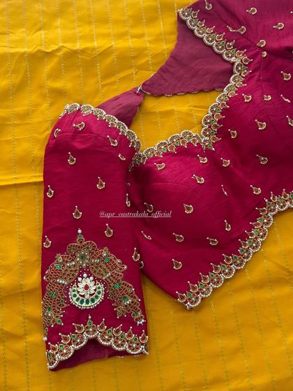 The front view of the magenta jewellery concept blouse, showing how the neckline embroidery sits perfectly.