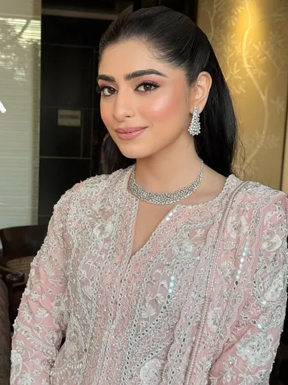 The complete Roka look for Shubhangi. Her soft glam makeup and simple ponytail create an elegant and timeless feel.