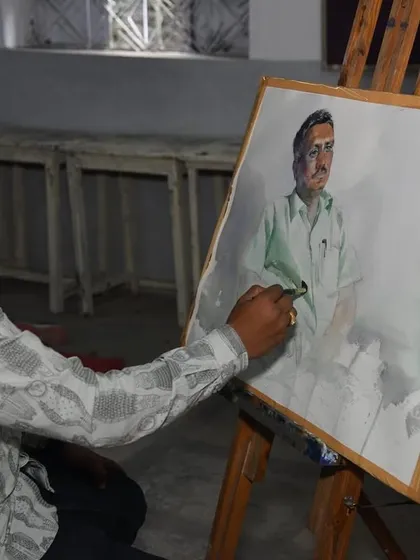 I am captured here in the middle of the painting process, focusing on the details of the face and shirt.