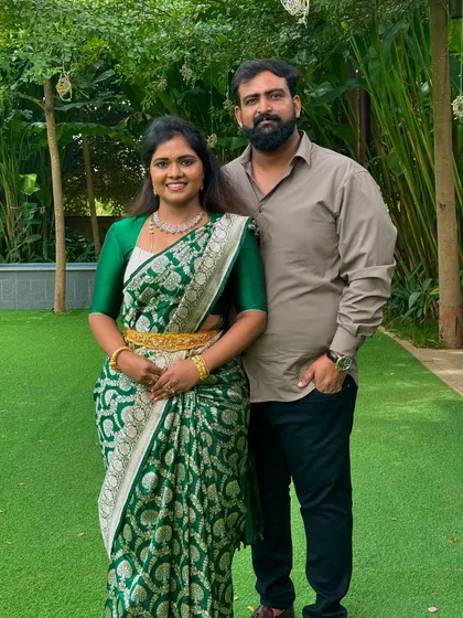 Another shot of this beautiful couple. The elbow-length sleeves and classic cut of the green blouse I designed create a timeless and sophisticated silhouette.