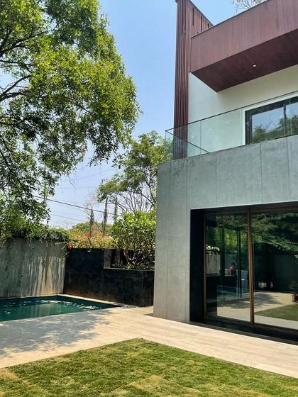 This view highlights the private pool and backyard of the Koramangala residence, where we used clean lines and natural materials to create a serene, private oasis.