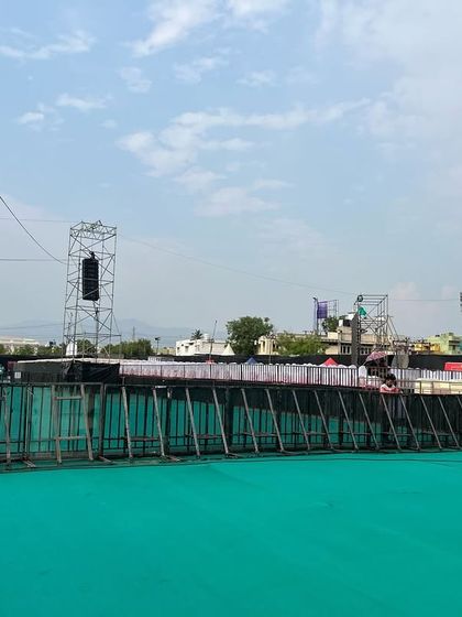 A wide view of the barricade line at the Harris Jayraj show in Salem. For massive open-air concerts, an extensive and interconnected barricade system is crucial for defining the audience area and ensuring safety.