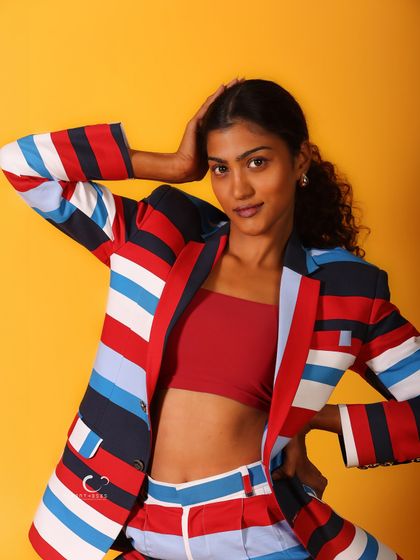 A beautiful close-up that captures a natural and relaxed moment. The hand in her hair adds a touch of candid grace.
