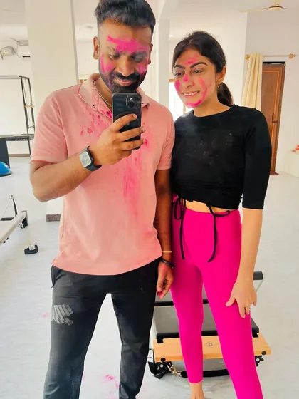 We even celebrate festivals together! A fun, colorful post-Holi workout selfie with a client.