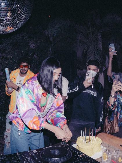 Cutting my birthday cake on the DJ console. It’s a perfect example of how I mix work and celebration.