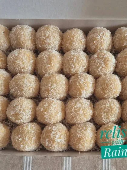 A large box of Coconut Laddoos, perfect for parties or family gatherings. They are always a crowd-pleaser.